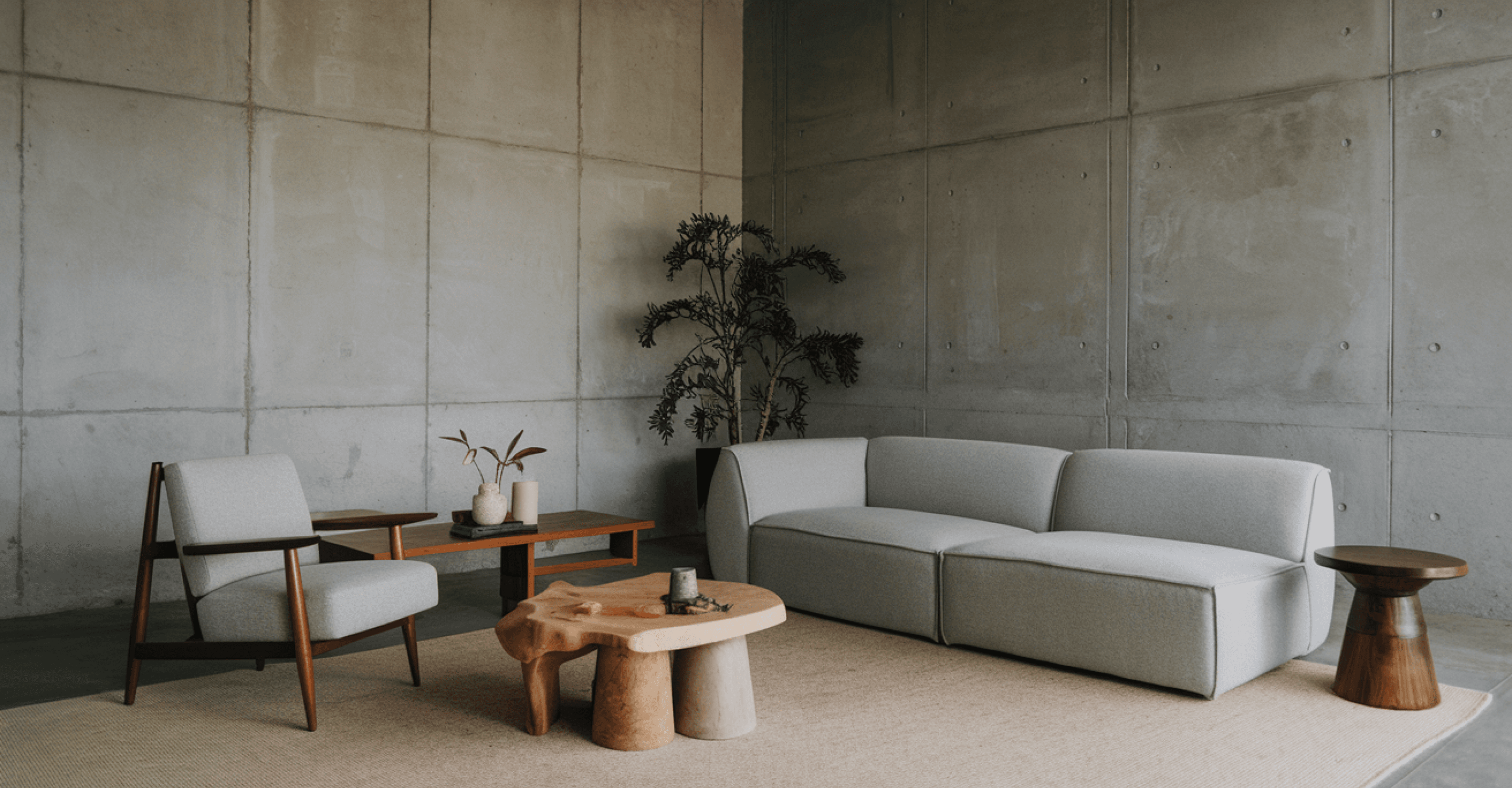 Living room with gray armchair and two-seater sofa